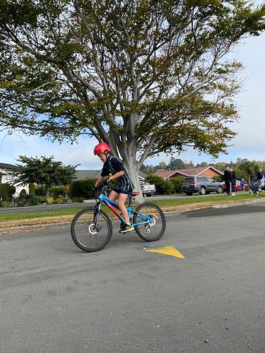 Fletcher Ho completing the bike stage for Columba Lakers