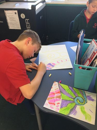 Marshall concentrating on his colour combinations and colouring up to the chalk line.