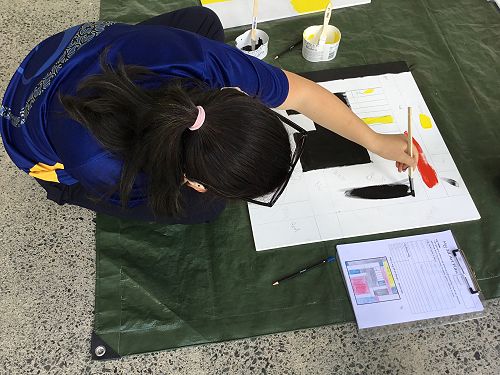 Ariana painting her abstract art