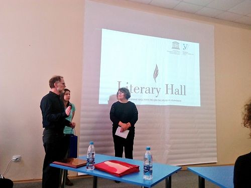 David Howard receives a presentation at the opening of Literary Hall. 