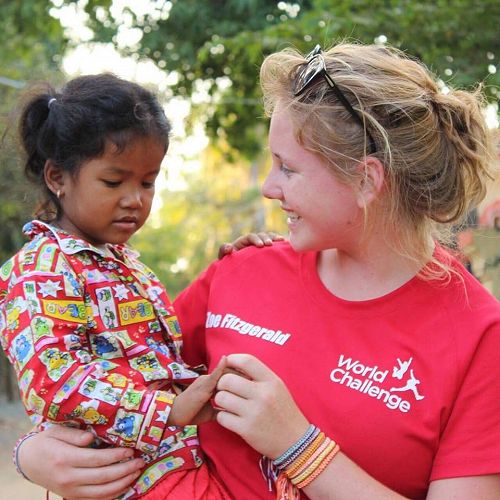 Zoe making a friend on the 2017 Thailand and Cambodia World Challenge trip