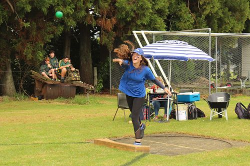 Stewart House Captain Libby Drake throwing the shotput for Senior Girls