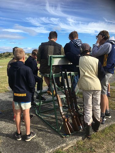 John McGlashan College students gather round to assess the scores of their first shoot of the season
