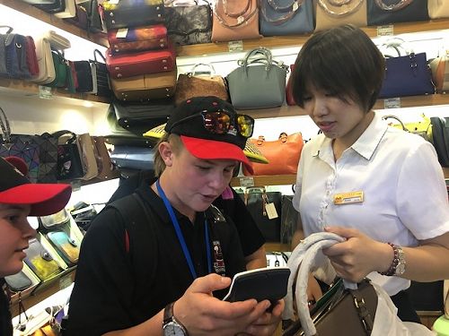 Flynn bartering for a handbag