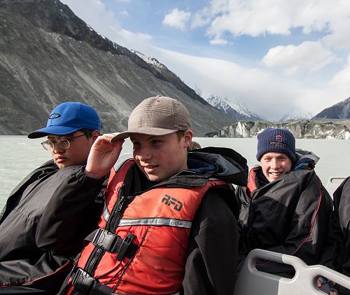Jin Kim, Jack Grey and Angus Frew with the Tasman Glacier in view behind. 