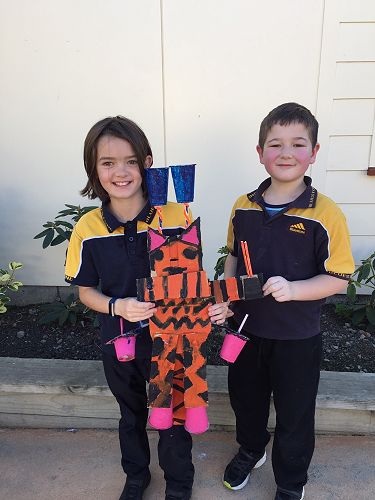 Kyla and Connor with their robot.