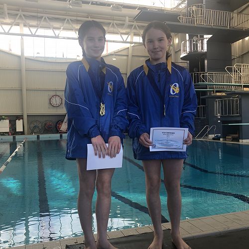 Mia and Emily North with their medals.