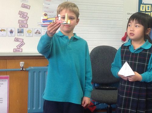 Thomas proudly shares his learning goal "I want to get better at building", whilst Yolanda listens and waits to share her Teepee.
