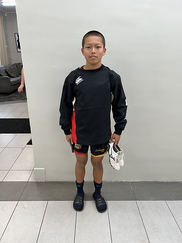 Kaho Suzuki (Year 10), from Japan, about to sign out to his rugby team training