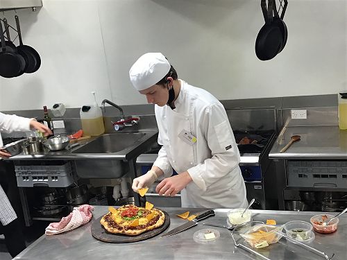 Reid making Nachos Pizza