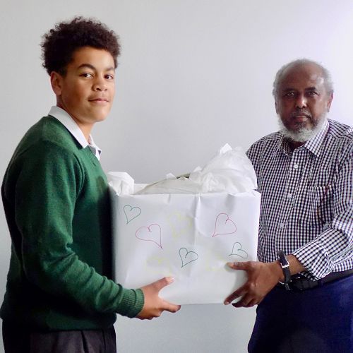 Villi presenting our gift to Mohammed Jama, President of the Mosque.