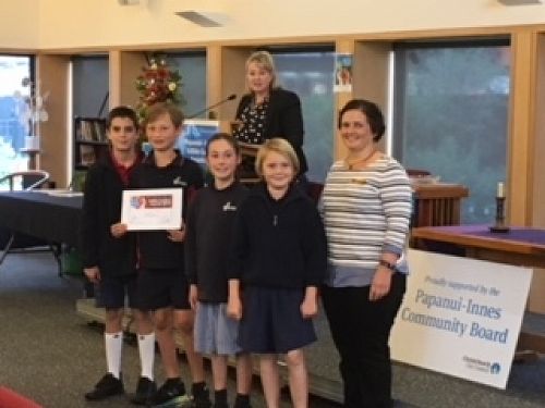 Samuel, Xavier, Adela and Phoenix receiving the award on behalf of Wairakei School.
