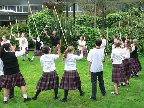  Matua Tip and students using rakau