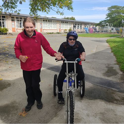 Olivia demonstrates kindness when she encourages her friends.