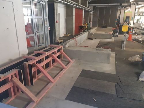 The foundation for the temporary wall and ramps in the north west atrium