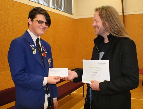 George Gibbs presents $3000 cheque to Cieran from The Mental Health Foundation