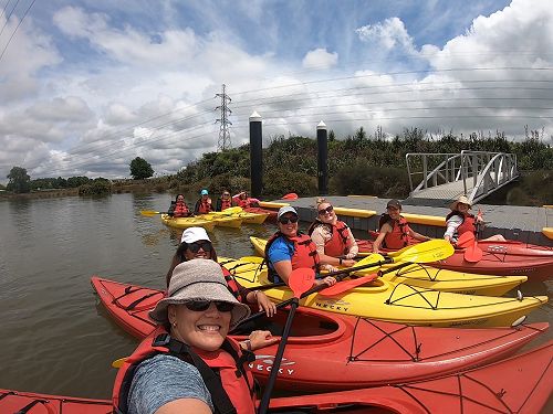 Kaiako learning the local histories as they kayak down our awa. 