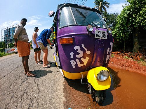 Josh and Sean fixing Rocky with the aid of a passer-by. 