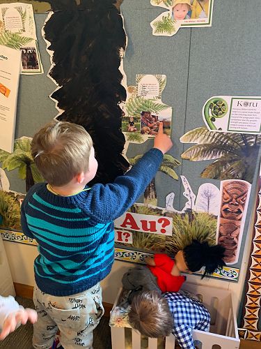 Jonty looking at our family tree Sumner