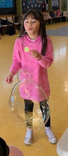 Olivia making bubbles at KIT Day