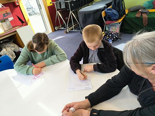 Emily and Jacob completing a maths task at the Otago Deaf One Day School