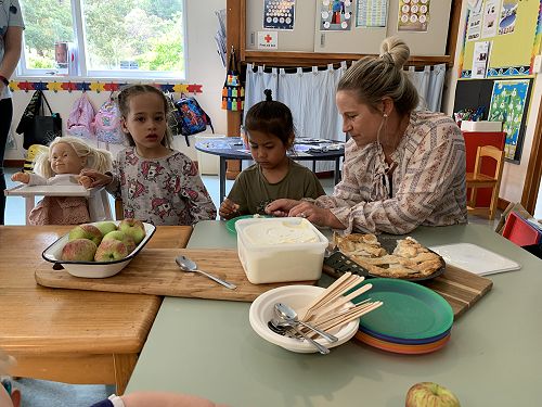 Evie, Raiden and Hayley making apple pie at Sumner