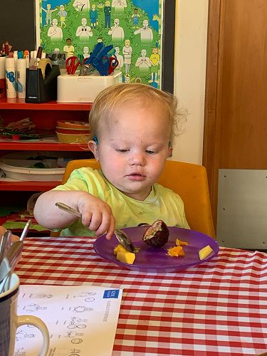 Wyatt trying a fruit kebab Sumner