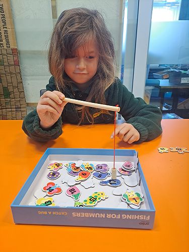 Aiyanna playing her favourite fishing game