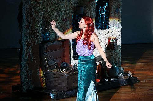 Ariel in her grotto with all her human treasures