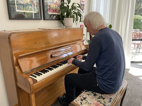 Rodney checking on the newly repair OCH piano