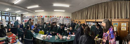 Thirty-six keen Japanophiles learn how to write their names in Japanese and line up for dessert.