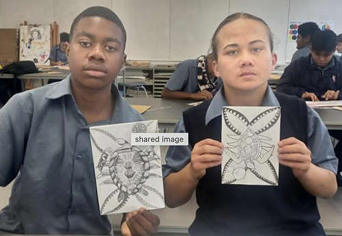 Frank and Hearty showing their Artwork