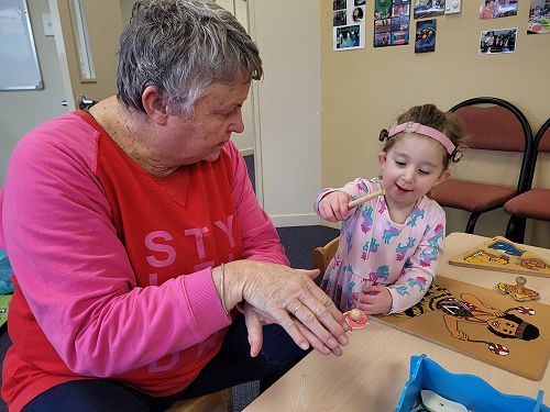 Ellie playing a fishing game with Michelle  at Dunedin Playgroup