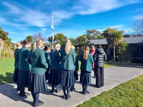 Learning about the native plants around the marae.