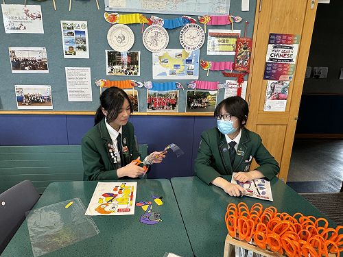 Hilarie and Isabella are making shadow puppets