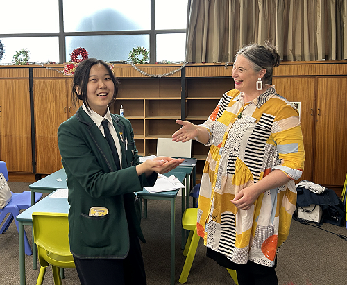 Cynthia  (Year 9) receiving her Foundation Level badge from Mrs Pettigrew
