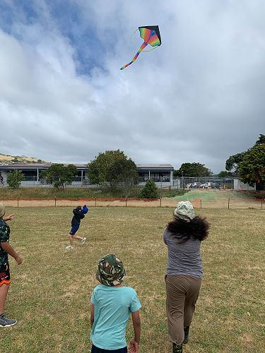 Cassius, Carter and Seaz watch the kite flown by Rinoa