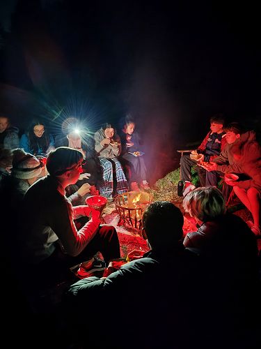 Kai o te pō (dinner) under the stars at Māori camp.