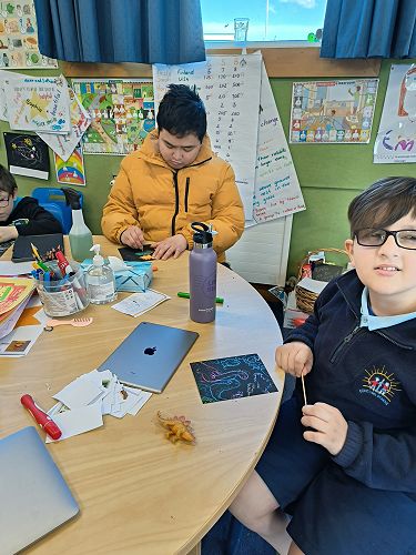 Jood working on a scratch picture activity