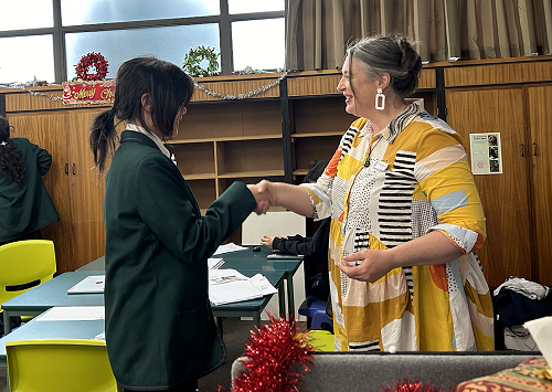 Sophie (Year 8) receiving her Foundation Level badge from Mrs Pettigrew