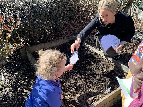 Bree and Hayley making vegetable labels at Sumner