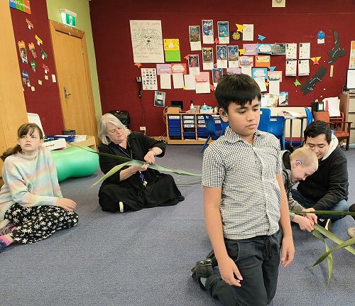 Everyone helping each other start their putiputi