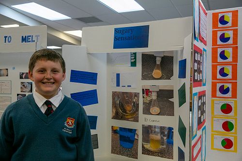 Sudent with Science Fair board