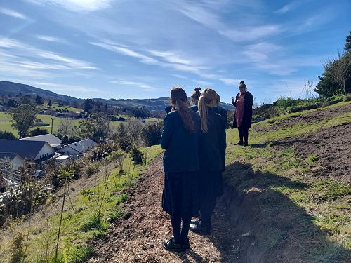 Learning about the health benefits of growing kai and giving back to the community.