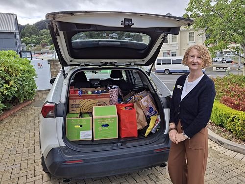 Elaine and a boot load of food for The Valley Project
