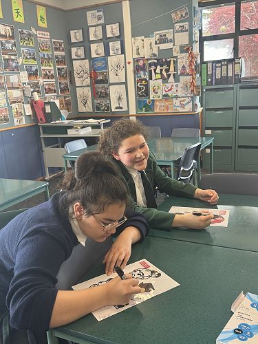 Eve and Abigail are making shadow puppets