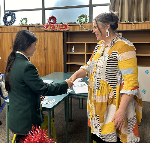 Alice (Year 8) receiving her Introductory Level badge from Mrs Pettigrew
