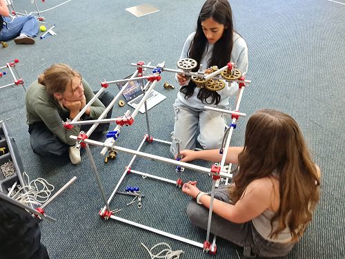 Ruby Arya and Cristobel work on their cogs
