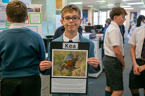 Caiden (Year 8) with his photo of a Kia