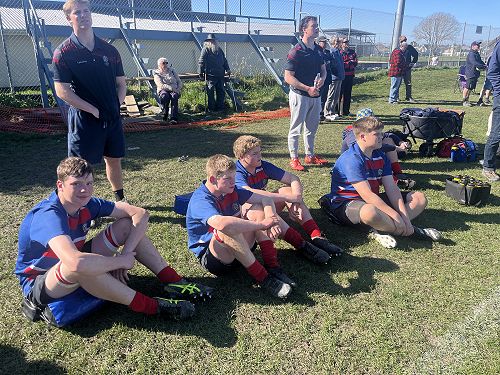 boys having a break on the sidleine